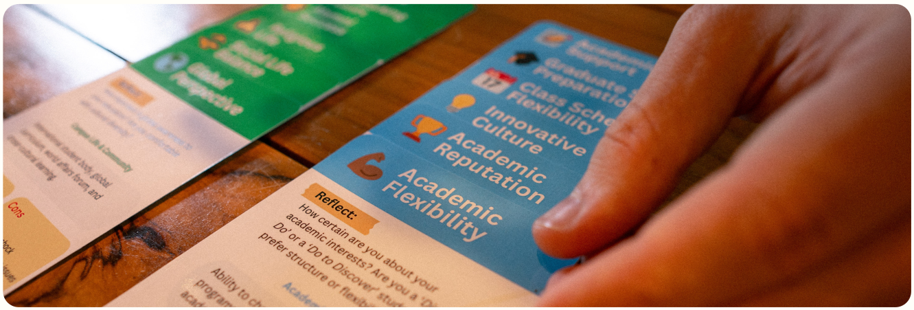 Student sorting university decision cards by priority